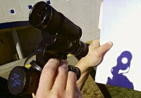 Projecting the Sun's image using a pair of binoculars. Click for larger version, 50 KB (Image: 'ThudsCave' website)